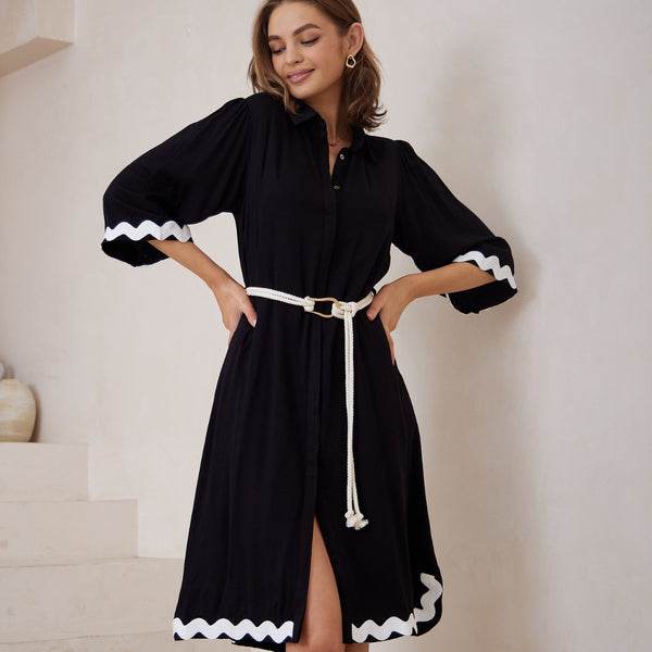 This midi dress has a collar, button front, half length sleeves and a detachable rope belt