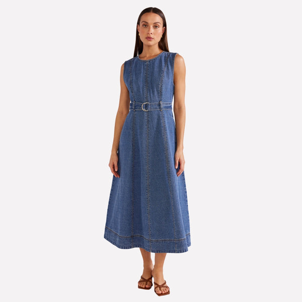 This dress is made from a mid blue denim fabric.