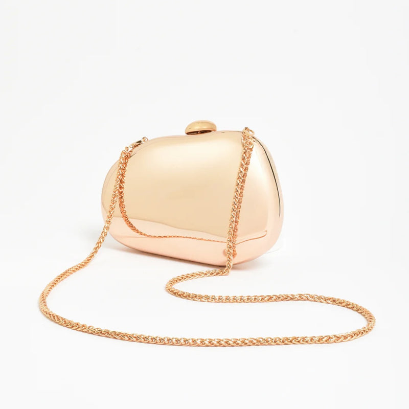 This sculptural gold clutch also has a detachable gold shoulder chain.