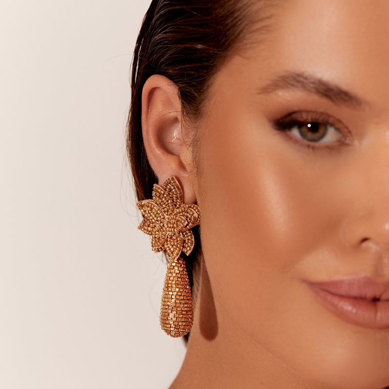 Model wearing our Aila Beaded Earrings in Gold