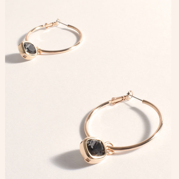 Andie Jewel Drop Hoop Earrings in gold with a smoke (grey) glass jewel drop