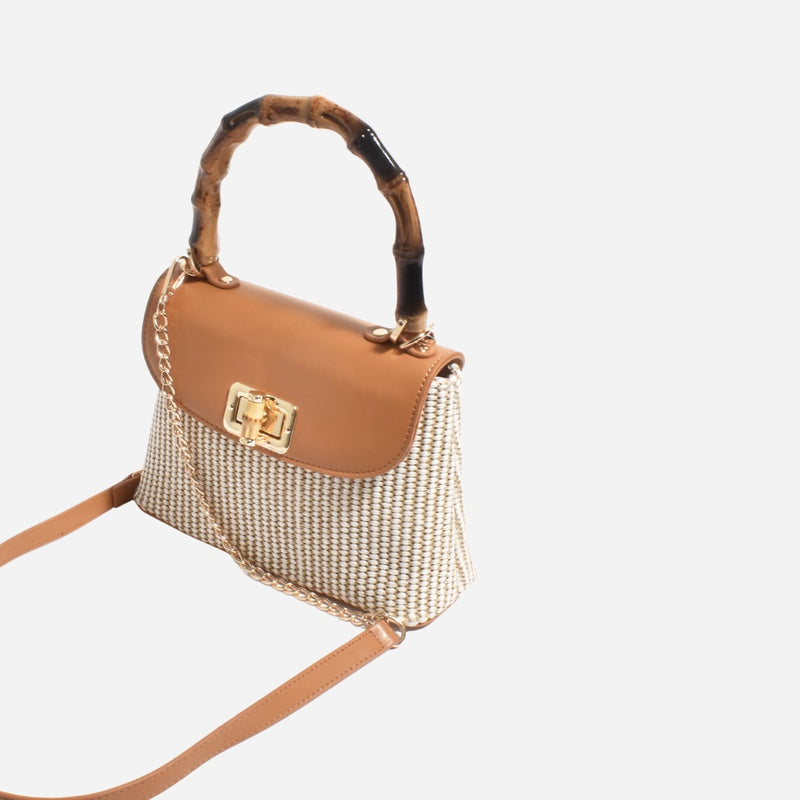 The bag also has a detachable gold chain and vegan leather shoulder strap