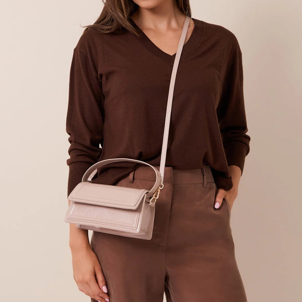 This beige handbag can also be used as a crossbody bag - using the detachable strap.
