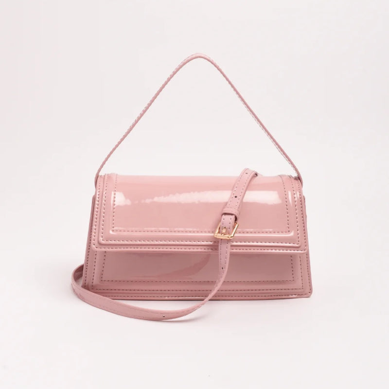 This pink bag also has a detachable crossbody strap which is adjustable.