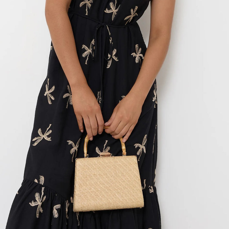 Model carrying the compact handbag.