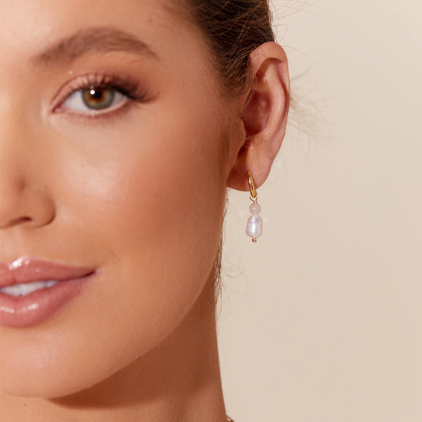model wearing the pink version of these earrings