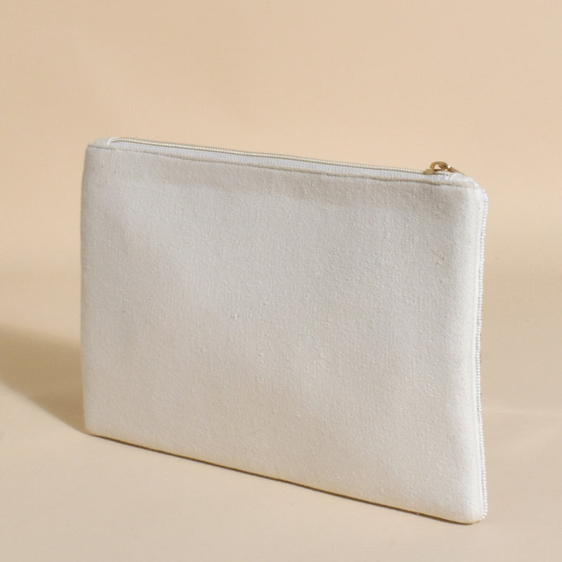 The clutch has a white fabric back