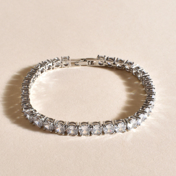 Our gorgeous CZ tennis bracelet has silver plated metal