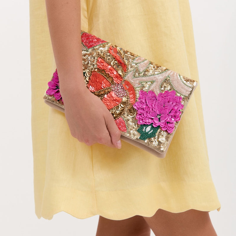 Claris Sequin Floral Clutch which has a fold over closure