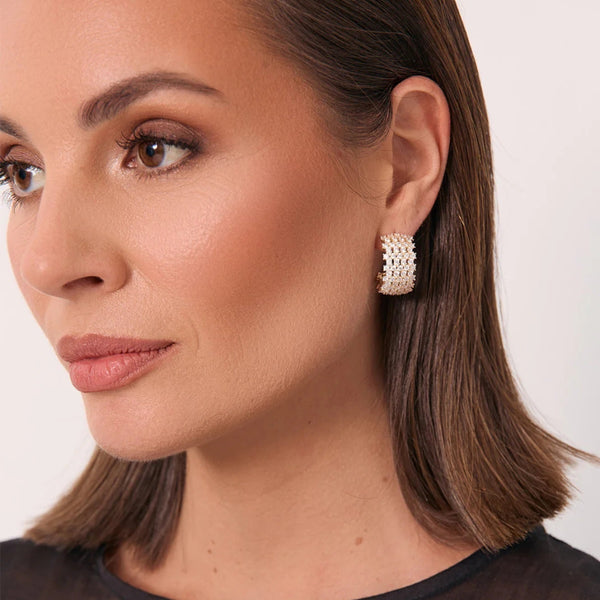 Model wearing these beautiful diamante hoop earrings.