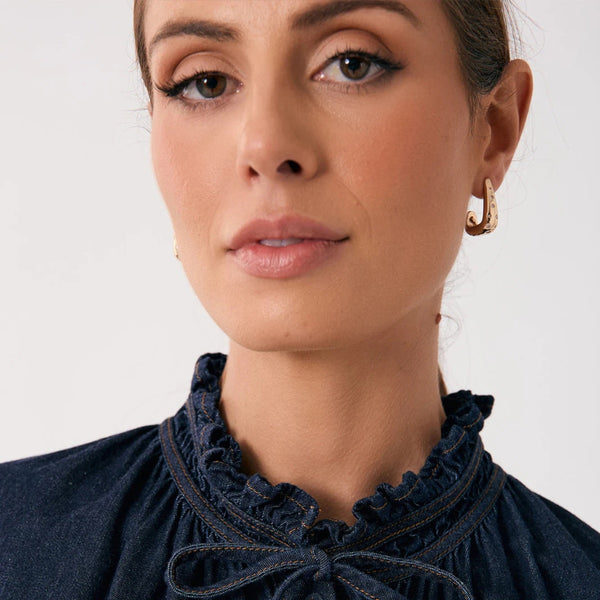 Model wearing the Diamante Set Curved Earrings in Gold