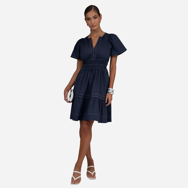 Eliana Dress in a navy cotton fabric with white top stitching. 