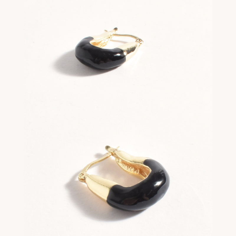 Enamel dipped metal square hoop earrings in black and gold.