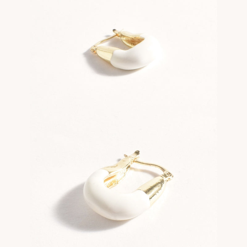 These square hoop earrings have a cream enamel dip on the base of the earrings.