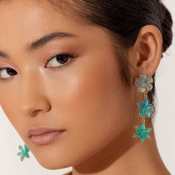 Model wearing the Enamel Floral Triad Earrings in green
