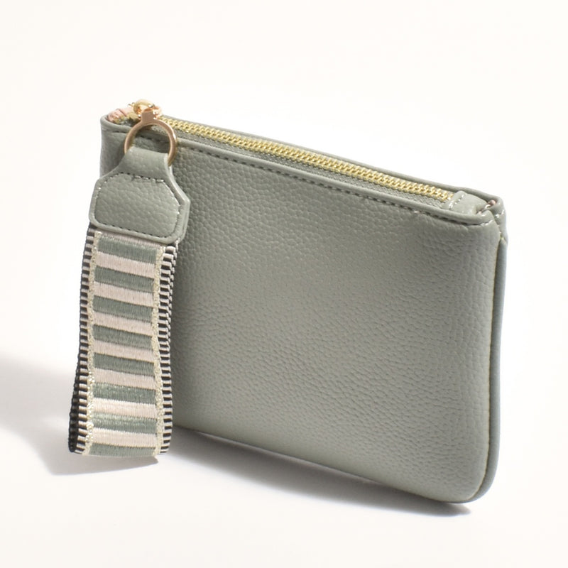 The clutch features a zip top closure and a webbed wrist strap