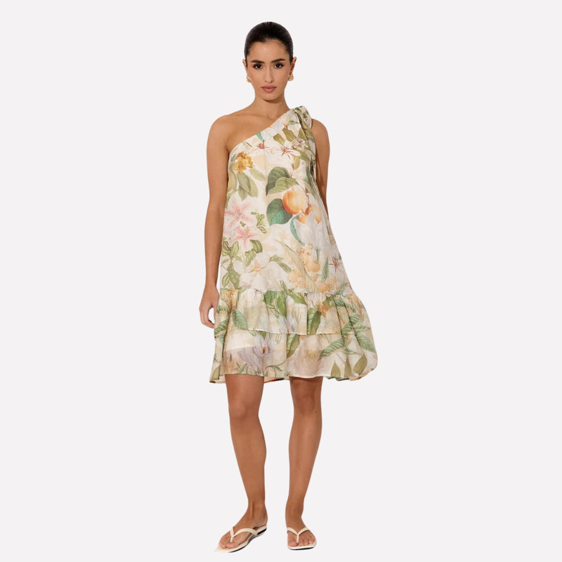 Our Frida One Shoulder Dress has an exclusive floral and peach print