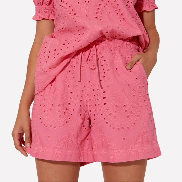 Gemma Deco Broderie Shorts in pink. They feature an elasticated waist with drawstring ties and front pockets