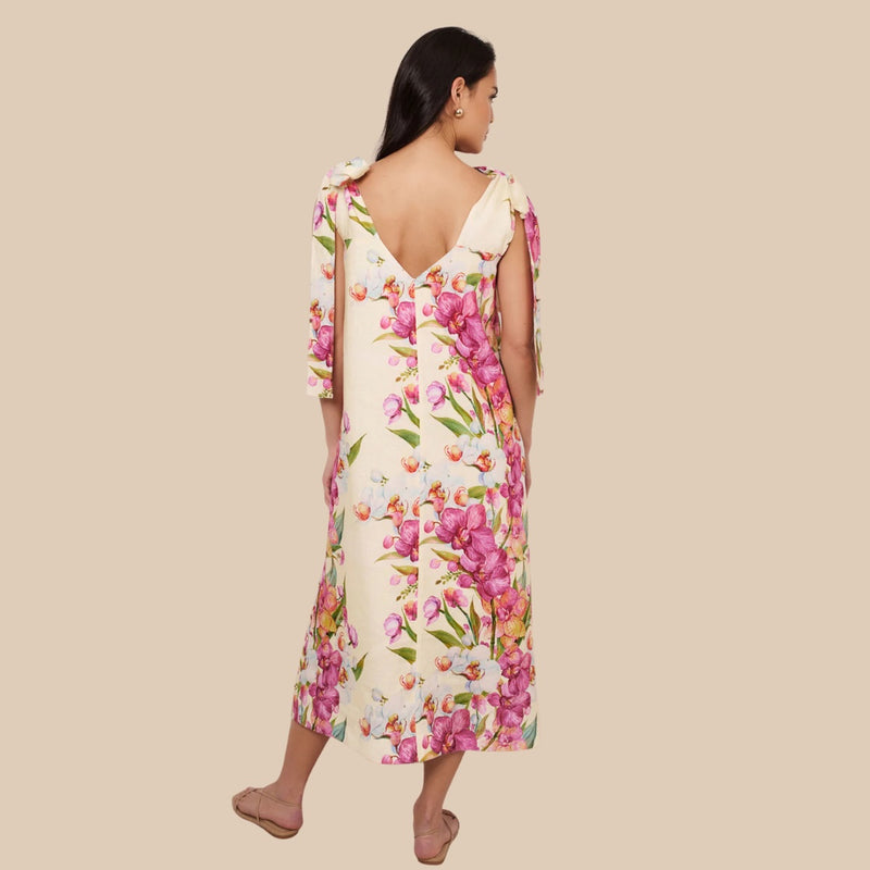 Back view of the dress - it also has a V neckline and an Aline body, finishing midi length.