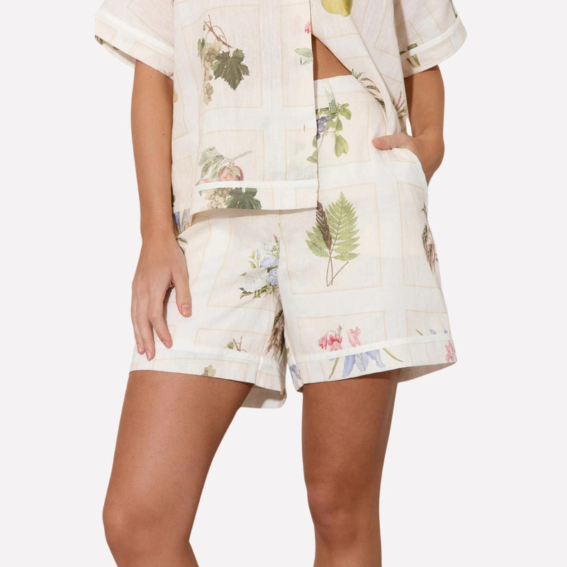 The shorts have a relaxed leg, pockets and feature white piping along the hem and pocket edge