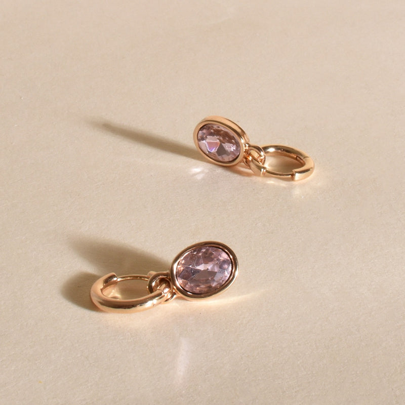 Inga Oval Jewel Drop Mini Hoop Earrings with a pink coloured jewel