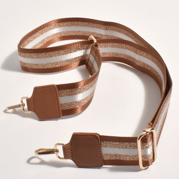 Jazmin Webbing Bag Strap with tan, white and metallic rose gold stripes. This strap is adjustable and has gold hardware