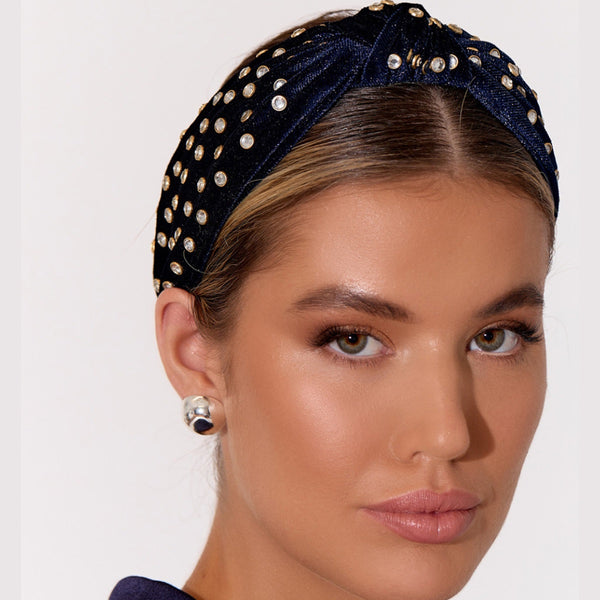 Model inspo pic featuring the navy version. Clear circular jewels with a twisted knot accent on the top of the headband