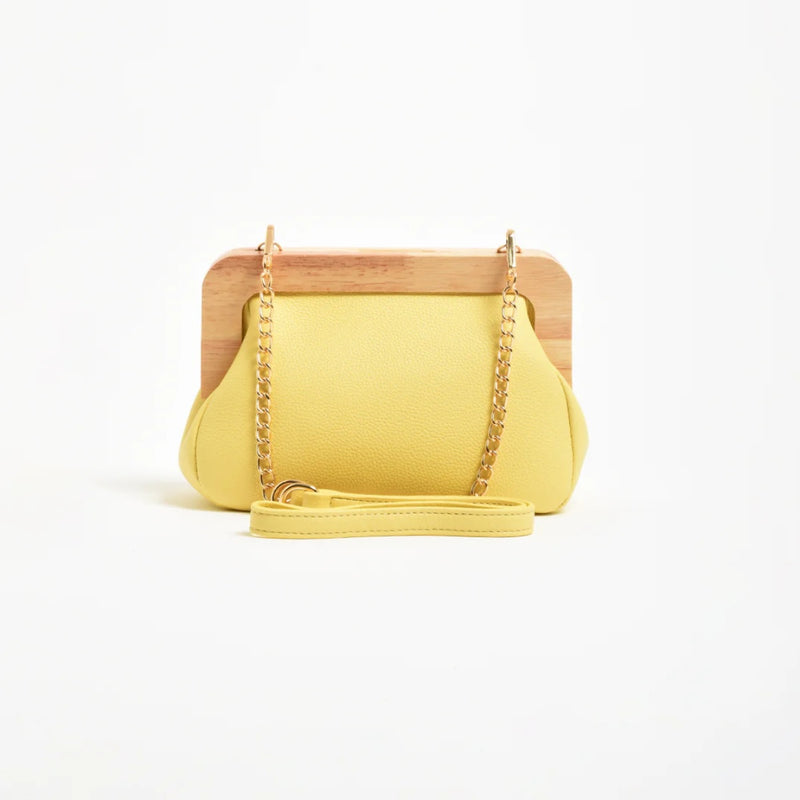 the clutch also has a detachable gold chain and vegan leather shoulder strap.