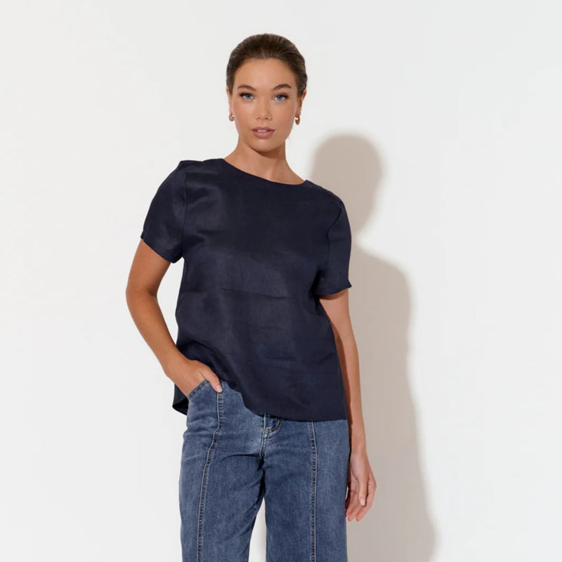 This linen top has a round neckline, short sleeves and it has a relaxed fit.