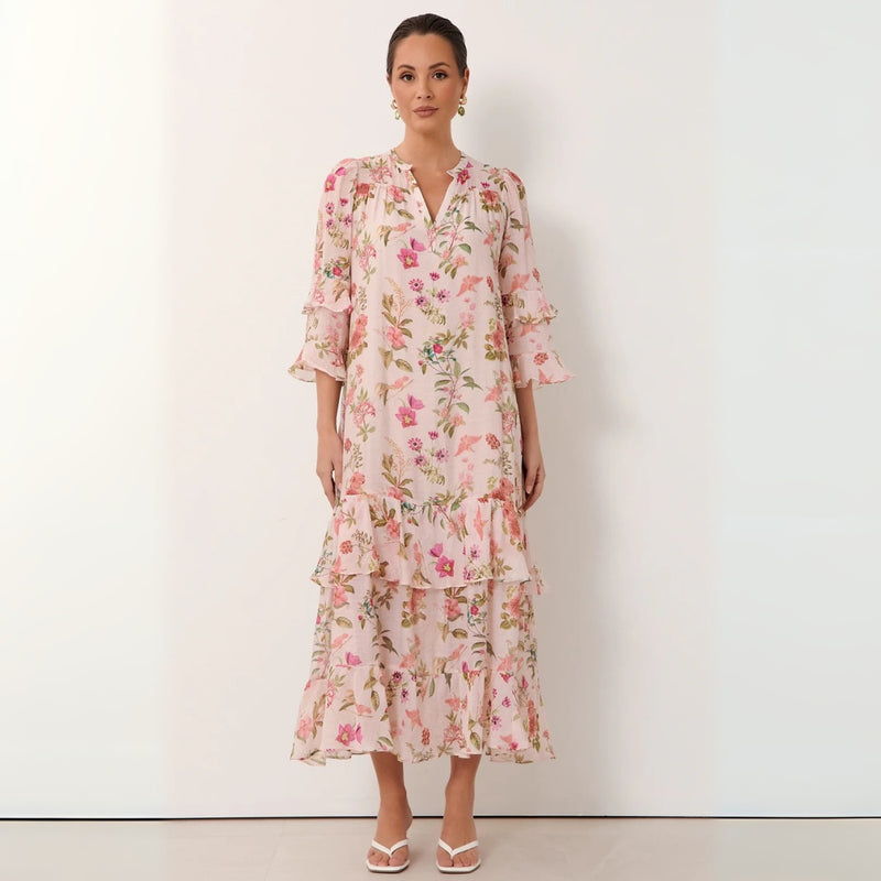 The dress can be worn loose flowing by removing the self print waist tie.