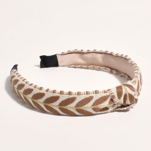 Leaf Pattern Headband in Tan and Cream with a gold thread detail and a knot on the top of headband