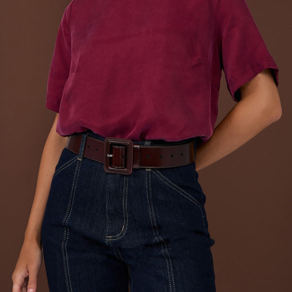 This wide belt has a rectangle buckle and a semi-gloss finish. Model inspo pic showcased here - wearing the chocolate brown version.
