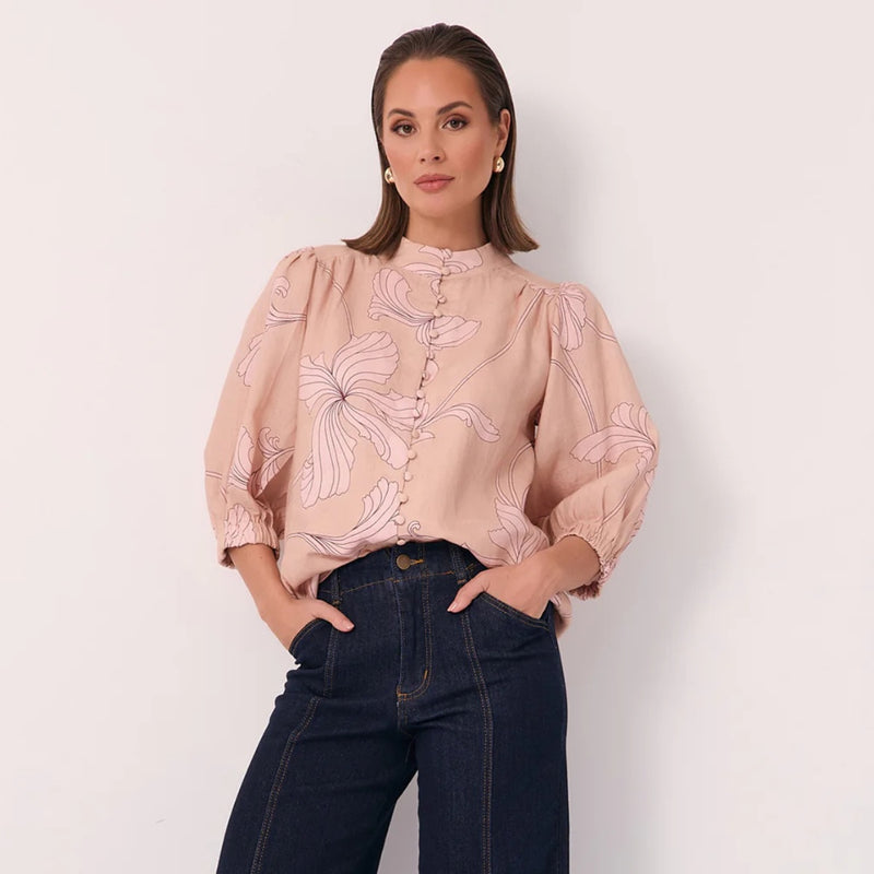 Our Lilian Salvador Shirt has an exclusive burgundy and pink floral print. Features a high round neckline, 3/4 length sleeves.