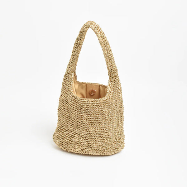 This metallic gold bag is lined and has a magnetic closure.
