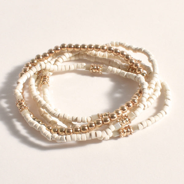 Lucinda Layered Bracelet Set with gold balls and cream coloured beads