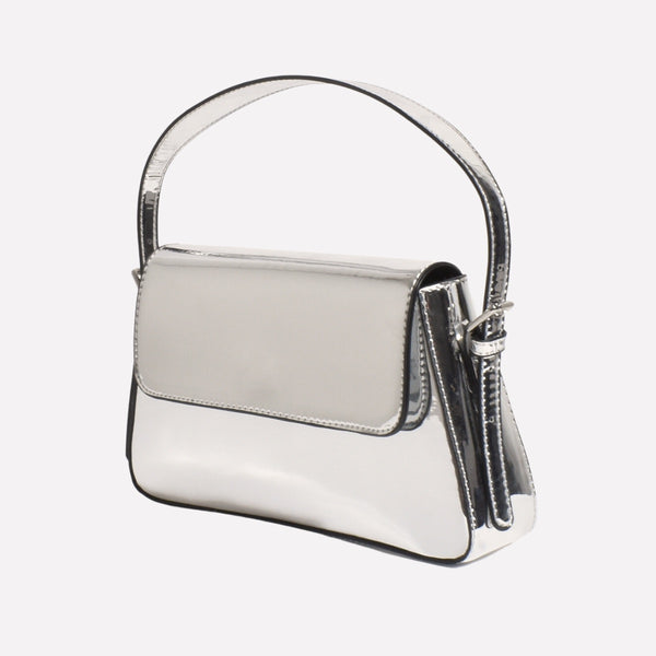The Maisie Handbag is made from a metallic vegan leather and it has a fold over front, magnetic closure and adjustable strap