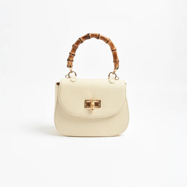 This cream bag has a bamboo look top handle and a fold over flap with gold clasp closure.