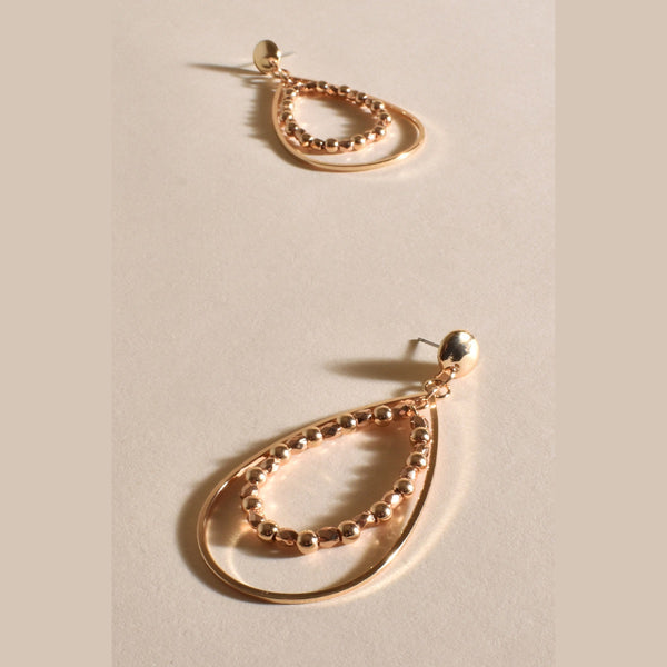 Metal Bead Teardrop Earrings with a stud closure and a double teardrop layer of gold metal and metal ball detail