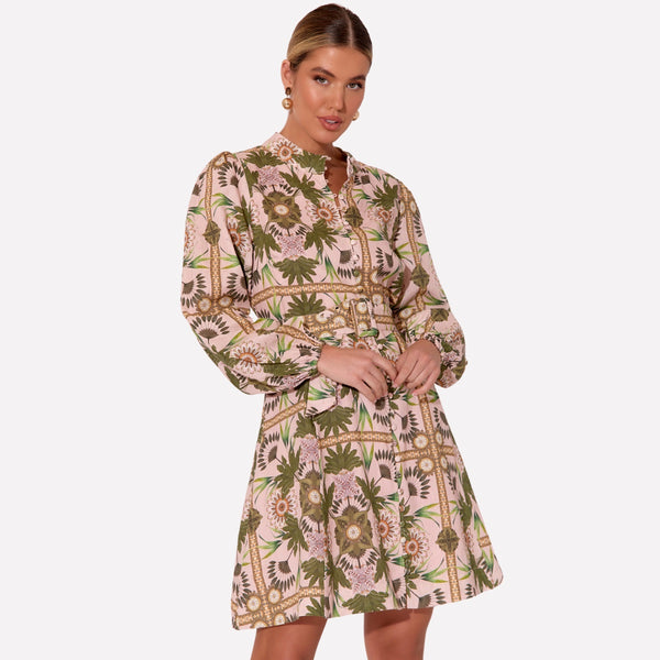 This dress features a mock collar, button front, long sleeves and an Aline skirt