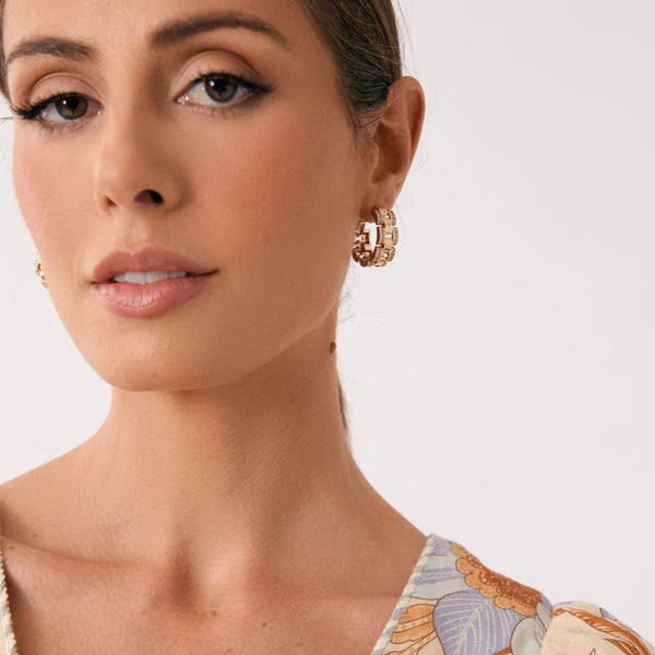 Model wearing our Mini Chain Hoop Earrings in Gold.