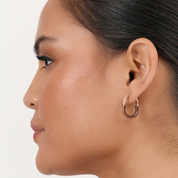 Model wearing our Mini Enamel Diamante Hoop Earrings in mocha and gold.