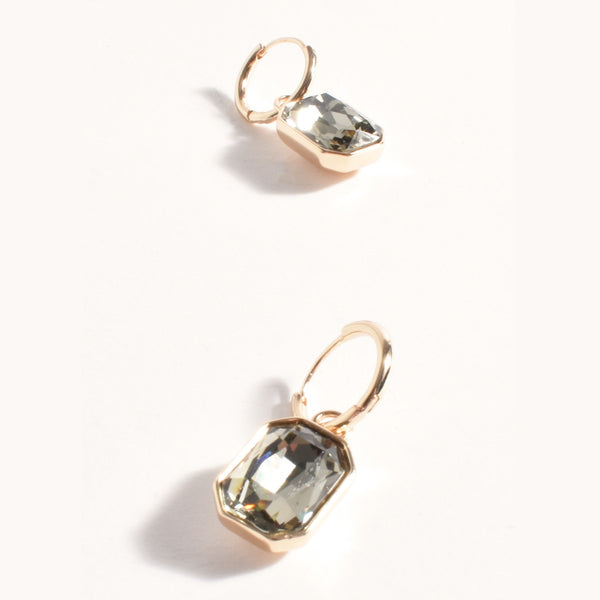 These gold hoop earrings have a small smoke coloured jewel suspended from the hoop.