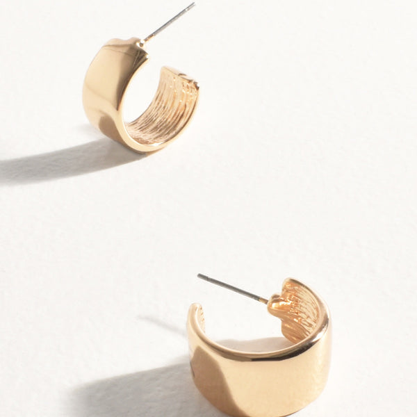 These mini metal gold hoop earrings have a stud closure.