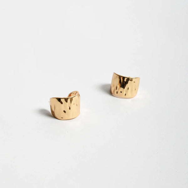 These textured gold earrings have a stud back closure.