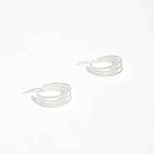 Our Mini Trio Metal Ball Hoop Earrings have a stud back closure.