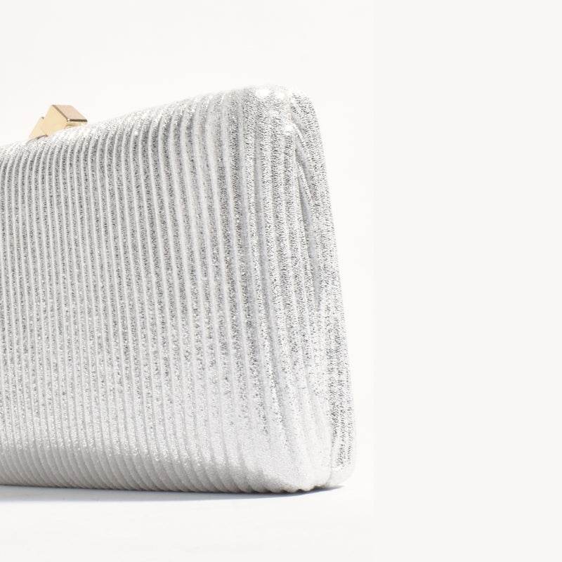 Close up of the sparkly ribbed silver fabric.