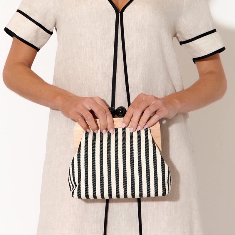 The clutch has a timber frame and is large enough to fit all your necessities