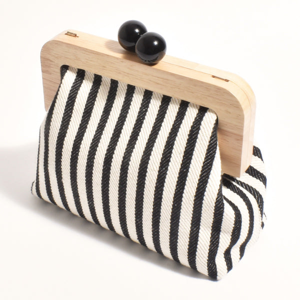 Neve Stripe Canvas Timber Frame Clutch in black and white