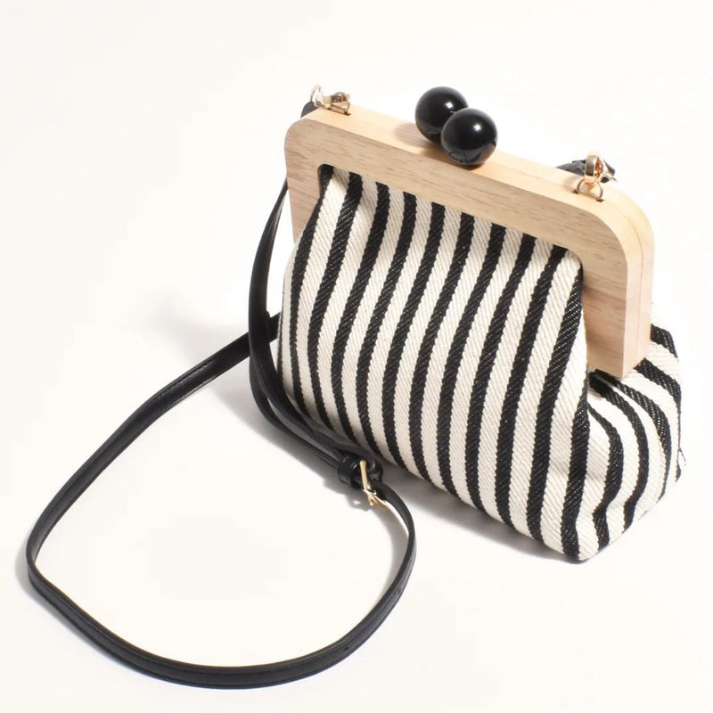 The clutch also has a detachable black shoulder strap