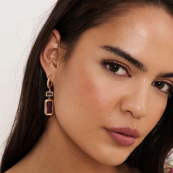 Model wearing our Rectangle Jewel Drop Twist Earrings in hot pink and gold.